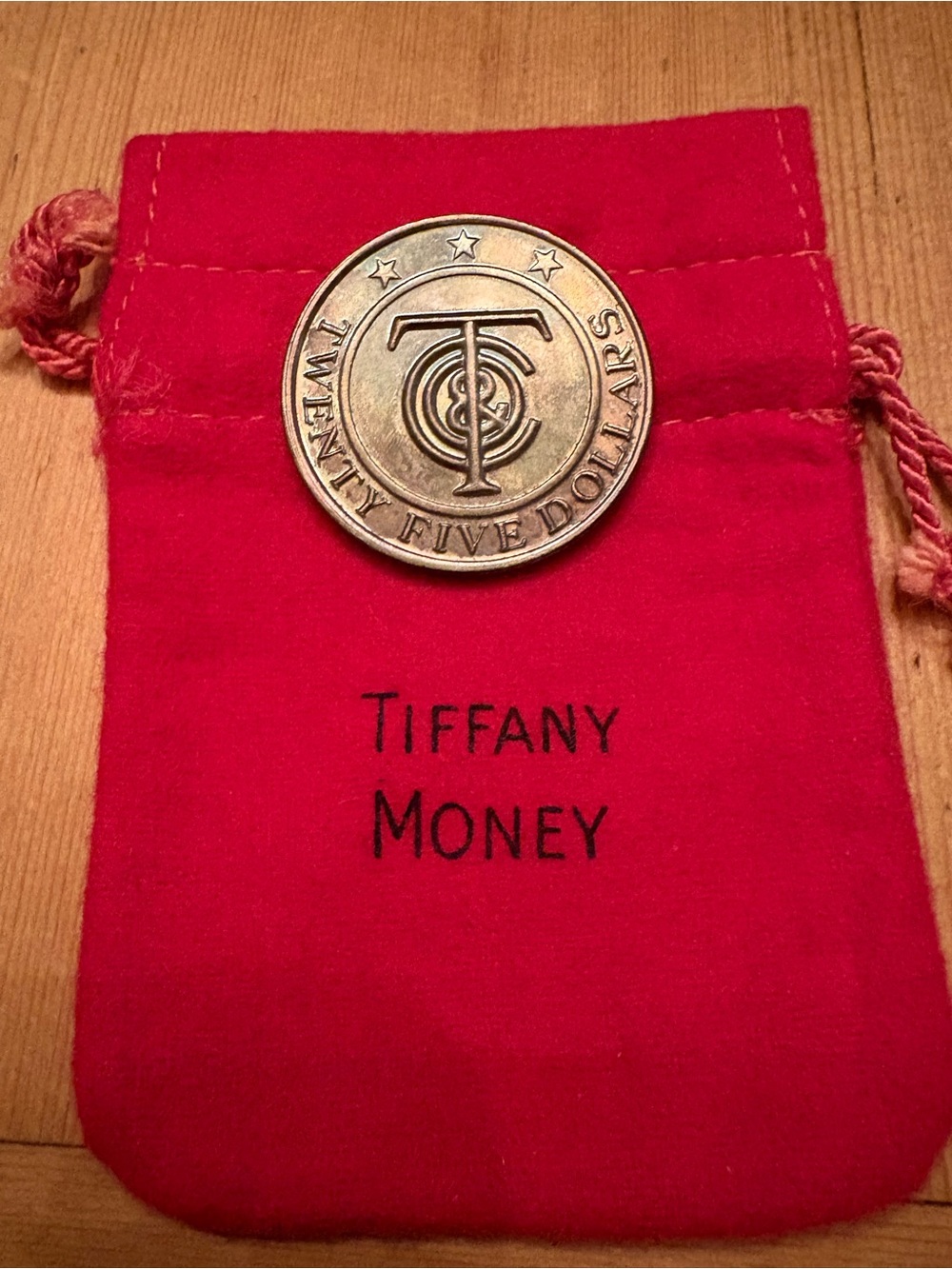Tiffany & Co. Vintage Silver $25 Tiffany Money Coin. Original Red felt pouch